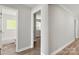 Hallway view showcases hardwood floors and provides access to the bathroom at 2322 Hedgewood Cir, Gastonia, NC 28052