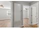 Hallway featuring hardwood floors, access to bedrooms, and a built-in storage cabinet at 2322 Hedgewood Cir, Gastonia, NC 28052