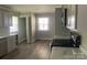 Clean kitchen with stainless steel appliances, laminate floors, and views to the outside at 2322 Hedgewood Cir, Gastonia, NC 28052