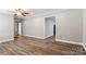 The living room features hardwood floors, grey walls, and white trim, with views into the hall at 2322 Hedgewood Cir, Gastonia, NC 28052