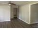 Well-lit living room featuring laminate flooring, neutral paint, modern ceiling fan, and white trim at 2322 Hedgewood Cir, Gastonia, NC 28052
