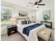 Bright bedroom with ceiling fan, neutral walls, carpet floors and a comfortable queen bed at 2401 Birnen Dr, Charlotte, NC 28210