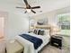 Bright bedroom with ceiling fan, neutral walls, carpet floors and a comfortable queen bed at 2401 Birnen Dr, Charlotte, NC 28210