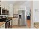 Kitchen area featuring stainless steel appliances and granite countertops at 2401 Birnen Dr, Charlotte, NC 28210