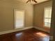 Bedroom featuring hardwood floors, natural light from windows and ceiling fan at 2433 Booker Ave, Charlotte, NC 28216