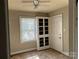 Bright bedroom with a window, a ceiling fan and a storage cabinet at 2433 Booker Ave, Charlotte, NC 28216