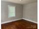 Bedroom featuring hardwood floors, neutral paint and natural light from window at 2433 Booker Ave, Charlotte, NC 28216