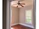 Cozy bedroom featuring hardwood floors, natural light, and a ceiling fan, providing a comfortable retreat at 2433 Booker Ave, Charlotte, NC 28216