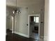Traditional dining room with dark wood floors and a vintage-style chandelier at 2433 Booker Ave, Charlotte, NC 28216