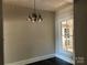 Classic dining room with dark wood floors and view to built-in cabinets at 2433 Booker Ave, Charlotte, NC 28216