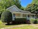 Charming home with a welcoming front porch and mature landscaping, offering great curb appeal at 2433 Booker Ave, Charlotte, NC 28216