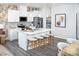 Modern kitchen boasts white cabinets, stainless steel appliances, and a spacious island with seating at 2460 Hedgecliff Rd, Kannapolis, NC 28025