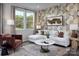 Bright living room featuring stylish furniture, large windows, and modern decor accents at 2460 Hedgecliff Rd, Kannapolis, NC 28025