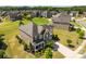 Aerial view of the house featuring mature landscaping and a well-manicured lawn at 2511 Carnation Dr, Harrisburg, NC 28075