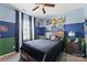 This unique two-tone bedroom offers blue and green walls, cool decor, carpet, and excellent natural light at 2511 Carnation Dr, Harrisburg, NC 28075