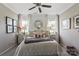 Cozy bedroom with plush bedding, decorative pillows, and abundant natural light at 2511 Carnation Dr, Harrisburg, NC 28075