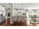 Kitchen with a large island, stainless steel appliances and views to the breakfast area at 2511 Carnation Dr, Harrisburg, NC 28075