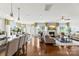Open-concept living space with hardwood floors, fireplace, and ample natural light at 2511 Carnation Dr, Harrisburg, NC 28075