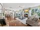 Expansive living room flows into the kitchen with hardwood floors and fireplace at 2511 Carnation Dr, Harrisburg, NC 28075