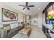 Upstairs living area with a large accent map, comfortable seating, and a staircase at 2511 Carnation Dr, Harrisburg, NC 28075