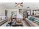 Comfortable living room with hardwood floors, shiplap accent wall, and staircase at 2511 Carnation Dr, Harrisburg, NC 28075