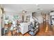 Bright living room boasts hardwood floors, stylish decor, and staircase access at 2511 Carnation Dr, Harrisburg, NC 28075