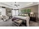 This spacious main bedroom features tray ceilings, neutral colors, and dual sitting areas near bright windows at 2511 Carnation Dr, Harrisburg, NC 28075