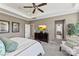 The main bedroom has neutral paint, a ceiling fan, and ensuite access for a relaxing private space at 2511 Carnation Dr, Harrisburg, NC 28075