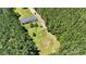 Expansive aerial view of a home with large backyard surrounded by lush green trees, offering privacy and space at 2784 Leadoff Rd, Lancaster, SC 29720