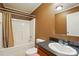 Cozy bathroom featuring a shower-tub combo and a single sink vanity with dark countertops at 2784 Leadoff Rd, Lancaster, SC 29720