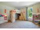 Sunlit bedroom with a unique loft bed and large window offering natural light at 2784 Leadoff Rd, Lancaster, SC 29720