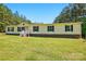 Single level home with yellow siding and black shutters in a green lawn setting at 2784 Leadoff Rd, Lancaster, SC 29720
