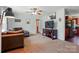 Living room featuring a large sectional sofa and a modern media center at 2784 Leadoff Rd, Lancaster, SC 29720