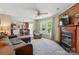 Bright living room with fireplace, adjoined to the kitchen, offers ample seating at 2784 Leadoff Rd, Lancaster, SC 29720