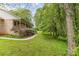 Spacious backyard featuring lush greenery, mature trees, and a peaceful, natural setting at 302 6Th Sw St, Conover, NC 28613