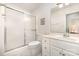 Bright bathroom with a shower and sink and white cabinets at 302 6Th Sw St, Conover, NC 28613