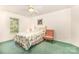 Bright bedroom with a ceiling fan and a window provides comfort and natural light at 302 6Th Sw St, Conover, NC 28613