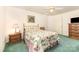 This cozy bedroom features a ceiling fan and coordinating nightstands at 302 6Th Sw St, Conover, NC 28613