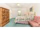Bright bedroom features a ceiling fan, a window overlooking trees, and stylish furniture at 302 6Th Sw St, Conover, NC 28613