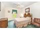 Cozy bedroom with a bed, window, ceiling fan, and coordinating furniture at 302 6Th Sw St, Conover, NC 28613