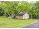 Well-maintained brick home with an attached garage, black shutters and a covered patio at 302 6Th Sw St, Conover, NC 28613