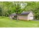 Well-maintained brick home with an attached garage, black shutters and a covered patio at 302 6Th Sw St, Conover, NC 28613