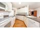 Functional kitchen with white cabinets, granite counters, and an open layout at 302 6Th Sw St, Conover, NC 28613