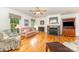 Inviting living room featuring hardwood floors, a fireplace, and a ceiling fan at 302 6Th Sw St, Conover, NC 28613