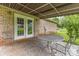 Covered patio includes stamped stone flooring and elegant wrought-iron patio furniture at 302 6Th Sw St, Conover, NC 28613