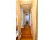 Inviting hallway featuring gleaming hardwood floors, neutral paint, and classic trim at 3232 Marlborough Rd, Charlotte, NC 28208