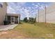 Spacious backyard featuring a screened porch and well-maintained lawn at 3252 Cheyney Park Dr, Charlotte, NC 28269