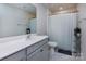 Clean bathroom featuring white cabinets and a shower with a white shower curtain at 3252 Cheyney Park Dr, Charlotte, NC 28269
