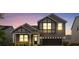 Charming two-story home showcasing craftsman architecture, dark trim, two-car garage, and manicured landscaping at 3252 Cheyney Park Dr, Charlotte, NC 28269