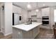 Modern kitchen with an island, white cabinets, stainless steel appliances, marble backsplash, and stylish pendant lighting at 3252 Cheyney Park Dr, Charlotte, NC 28269